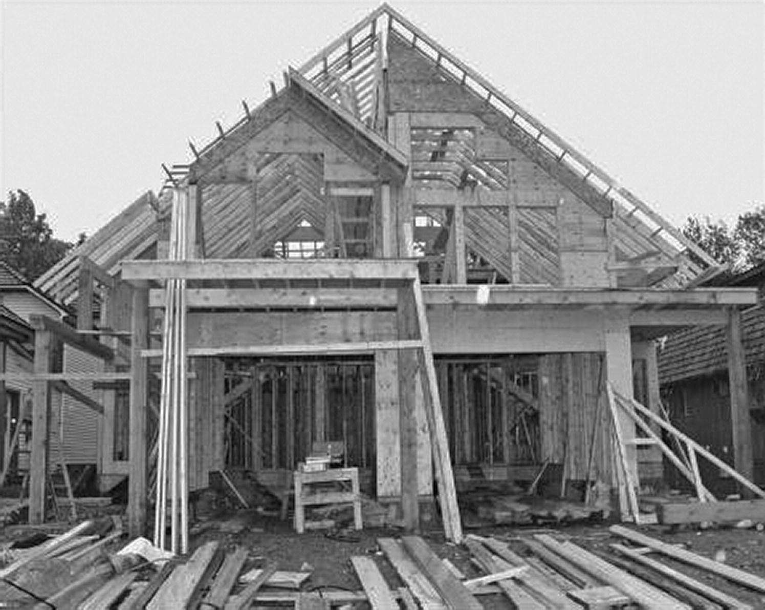 Photo of a self‐build timber frame house under construction.