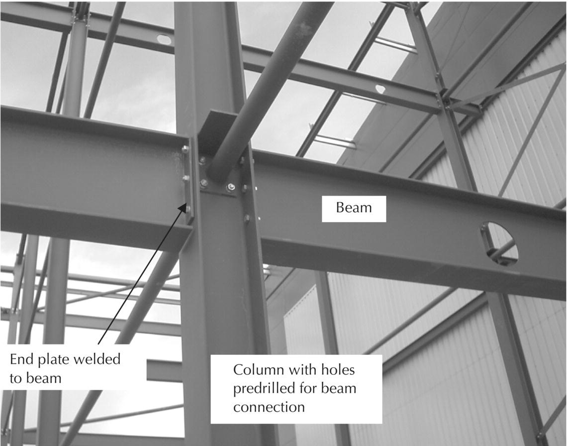 Photo displaying column and beam connection using end plates welded to the beam.