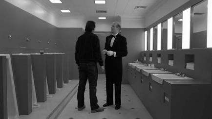 Figure 1.26 Crossing the 180° line, outgoing shot . . . In The Shining, Kubrick cuts across the 180° line to create a visual metaphor linking Jack (Jack Nicholson) and Mr. Grady (Philip Stone) as socially isolated characters by flipping their position from shot . . .