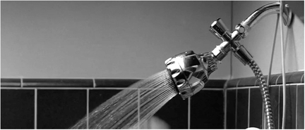 Figure 1.39 to a x-axis incoming shot.. . .“softens” the cut to the incoming shot, a close up of a shower head with a strong x-axis index vector. Source: Copyright 1986 Paramount.