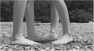 Figure 1.42 to a shot with converging x-axis vectors. . . .with the next x-axis shot of their feet stepping closer together. Source: Copyright 2012 Focus Features.