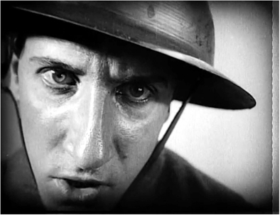 Figure 1.49 The Passion of Joan of Arc: looking into an event. Dreyer stages a close up of an angry soldier on a swing, cutting so that his face pushes forward in a rage towards the camera twice. Source: Copyright 1928 Société Générale des Films.