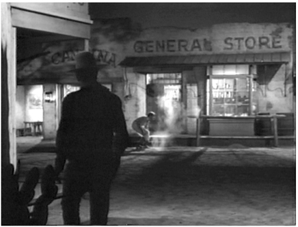 Figure 4.19 Shooting Liberty Valance: new point of view.. . .and the film dissolves back in time to show that event. Here, the second version of the event is shown from Tom Doniphon’s (John Wayne) point of view. Source: Copyright 1962 Paramount Pictures.