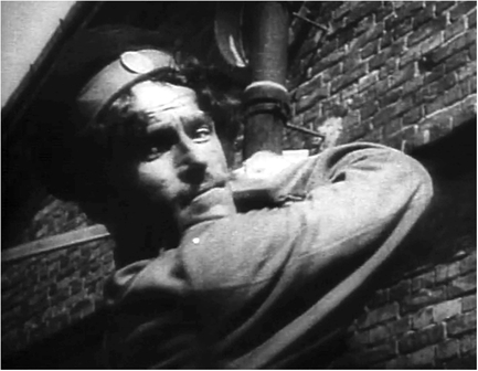 Figure 5.7. . .Eisenstein cuts to overlapping action of a Cossack slashing downward towards the camera, first in a medium close up . . . Source: Copyright 1925 Goskino.