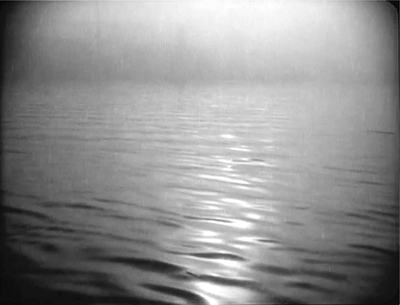 Figure 5.29. . .shot of the placid water’s “oily” surface swathed in light. The cuts move languidly back and forth – bouy/water/bouy/water – with the slowly fluttering gulls and the undulating water evoking the tranquil tone of the scene. Source: Copyright 1925 Goskino.