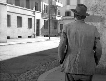 Figure 6.6 Bicycle Thieves (De Sica, 1948): staging in depth. As the father agonizes about stealing a bike, De Sica’s staging alternates between wide shots of the workman pacing back and forth in a kind of soul searching dance. Source: Copyright 1948 Ente Nazionale Industrie Cinematografiche.