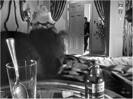 Figure 6.10 Citizen Kane (Welles, 1941): in camera double exposure. Bazin praised this deep focus scene from Kane where Susan attempts suicide, but the shot is not made with traditional “deep focus” techniques but actually made as a special effects shot created in camera. We can see that this scene is “faked” because the focus is split – foreground and background in sharp focus, but the middleground in soft focus, which is not possible with a single take where the depth of field would be continuous from near to far.