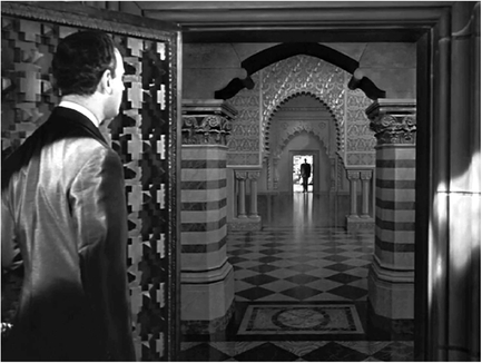 Figure 6.11 Citizen Kane (Welles, 1941): miniature projection. Kane was innovative for its day because of its extensive use of the optical printer developed by Linwood Dunn. This “deep focus” shot was created optically: the foreground is a prop door, the middle ground is a matte painting with Kane’s reflection on the floor, and the image of Kane a miniature projection printed into that composition. Source: Copyright 1941 RKO Radio Pictures.