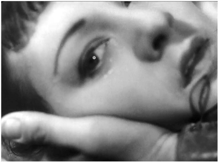 Figure 6.13 A Day in the Country (Jean Renoir, 1936): a rare close up. Renoir reserves a rare close up to show Henriette’s reaction after having sex on a secluded island in middle of a river. Bazin writes, “I can think of no other director, except perhaps Chaplin, who is capable of evoking such a wrenching bit of truth from a face, from an expression.” Source: Copyright 1950 Joseph Burstyn Inc.