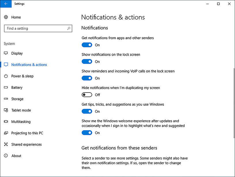 A screen shot shows the Notifications & Actions tab in the System Settings app. Displayed options are: Get notifications from apps and other senders, Show Notifications On The Lock Screen, Show Reminders And Incoming VoIP Calls On The Lock Screen, Hide Notifications When I’m Duplicating My Screen, Get tips, tricks, and suggestions as you use Windows, Show me the Windows welcome experience after updates and occasionally when I sign in to highlight what’s new and suggested.