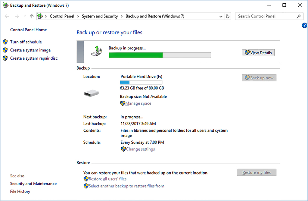 A screen shot shows the Backup And Restore (Windows 7) tool with the backup in progress. At the top of the screen is a backup progress indicator, and below this is information relating to the backup, including location, size, next and last backup dates, and the schedule. At the bottom of the screen are links for Restore operations.