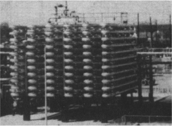 Photograph shows a longitudinal tubular reactor.