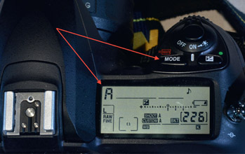 Figure 11.1: Nikon DSLR mode button and setting indicator.