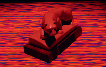 Figure 8.42: Lion and fabric under Roscolux 44 incandescent light, camera set to auto white balance.