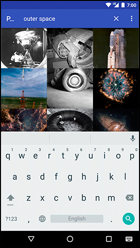 Screenshot shows the preview of outer space app. The screen shows thumbnails of images on top and keyboard below.