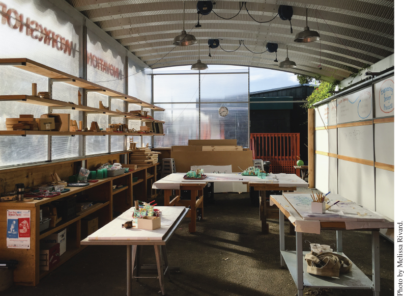 Photo of one of the rooms in the Innovation Workshop at Park Day School displaying several tables with pencils and other materials and shelves on the left side with filled with different tools and materials.