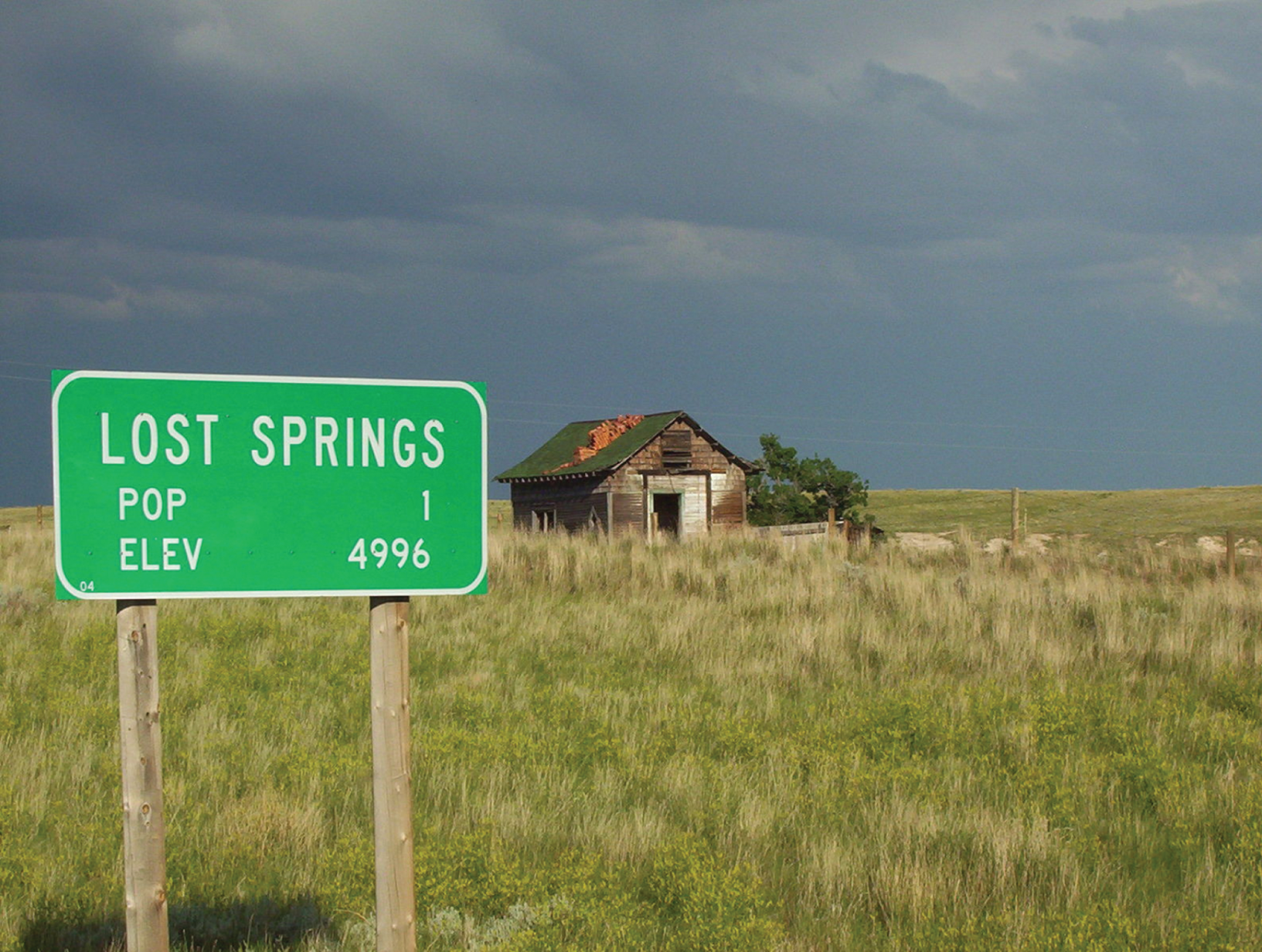 Photograph depicting a  traffic sign welcoming drivers to Lost Springs, Wyoming.