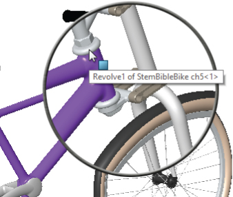 Front portion of a bicycle with magnifying glass at the small area near the head tube with a box labeled Revolve1 of StemBibleBike ch5<1>.