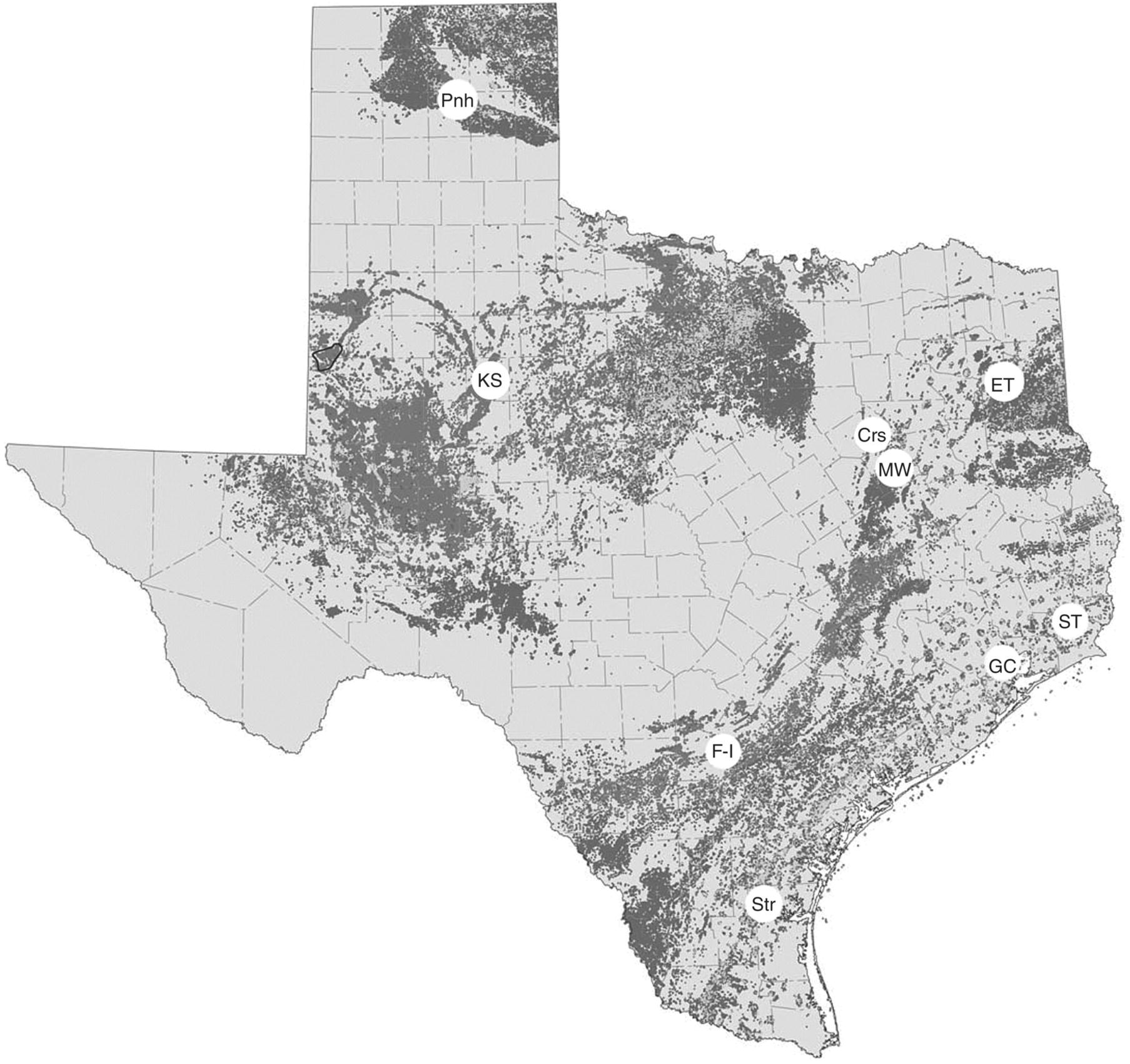 Map depicting the distribution of oil and gas wells throughout Texas with historically significant petroleum fields labeled Crs, ET, F–I, GC, KS, MW, Pnh, ST, and Str.