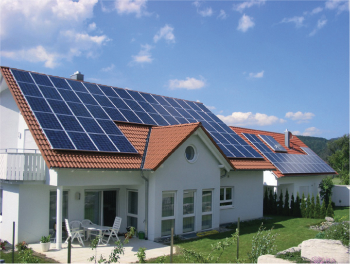 The illustration shows two houses, equipped with solar panels on the roof.