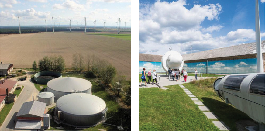 The illustration shows two pictures. The first picture shows a biogas plant in the form of two containers and several windmills are shown in the background. The second picture shows visitors standing at Germany’s first energy self-sufficient plant. 