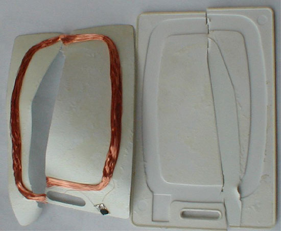 Photo shows broken ID card which displays internal construction.