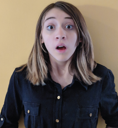 Photograph of a girl with a surprised expression on her face, which can be misinterpreted as fear.