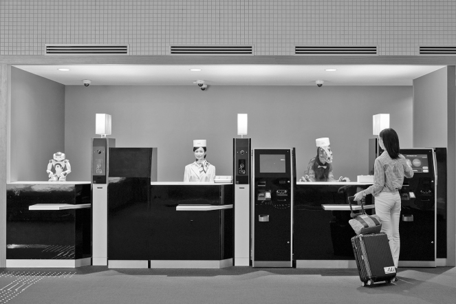 Photo illustration of robot desk clerks in Japan.