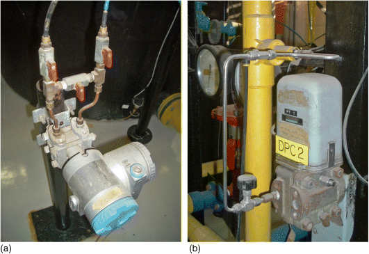 (a) and (b) Photographs depicting installed electronic and pneumatic DP cells, respectively.