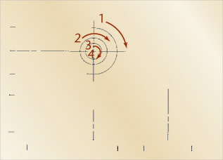 First step in designing hand layout of a metric three-view drawing is depicted.