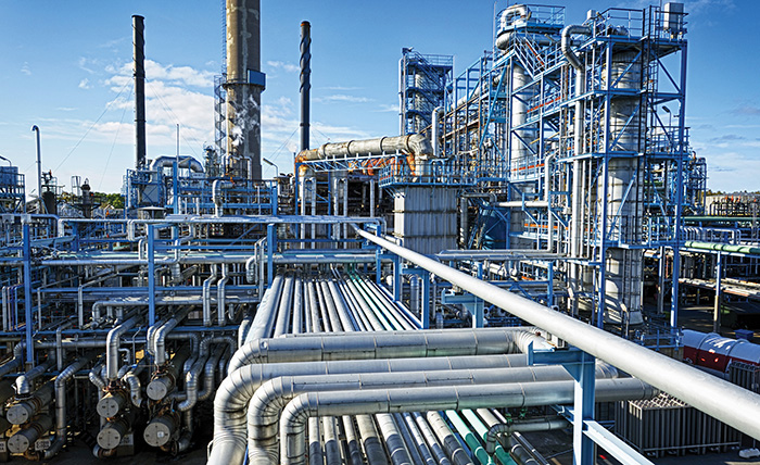 Photograph shows a Complex Arrangement of Pipes and Tubes at a Gas Processing Plant.