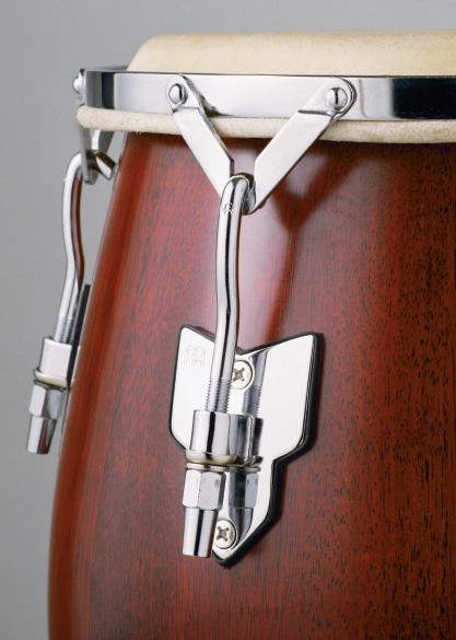 Photograph shows threads used for adjustment in a conga drum.
