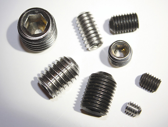 Photograph shows multiple headless set screws.