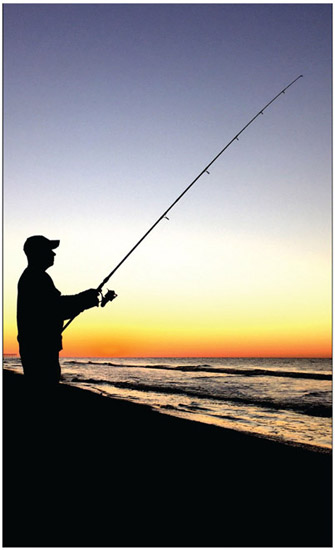 Figure 4.15 The element of shape is emphasized in this backlit photograph of a lone fisherman at sunrise.