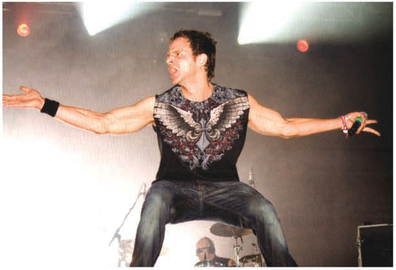 Rob Swire. Pendulum A flash action shot The symmetry of Rob's arms aligned with the wings on his T-shirt