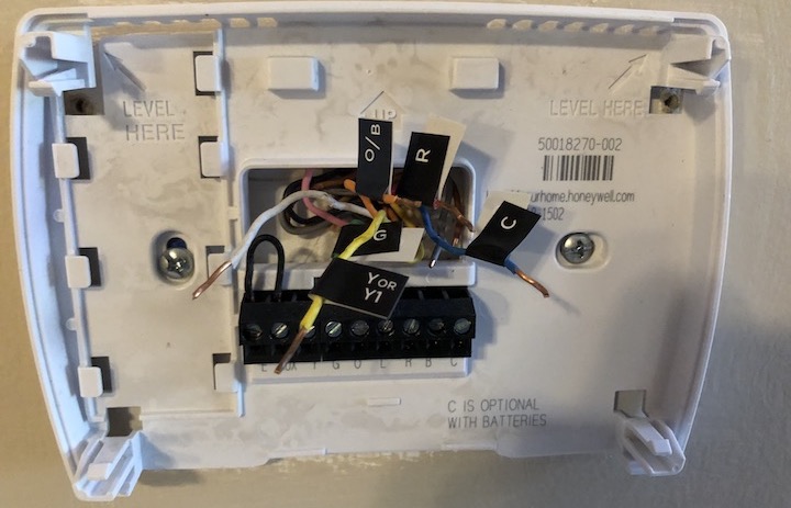 Figure 57: I’ve removed and labeled all of the thermostat wires, except for the white Aux wire, since ecobee did not include a label for it. Note that I left the black jumper wire behind.