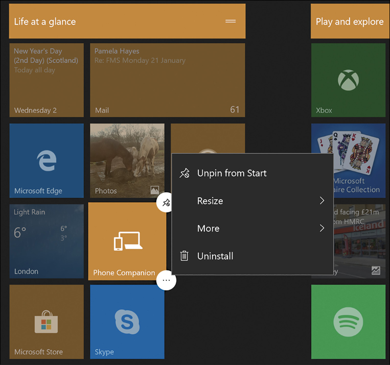 This screenshot shows the Windows Start screen with the Phone Companion tile selected and a Tile context menu displayed. The context menu has four options; Unpin From Start, Resize, More, and Uninstall.
