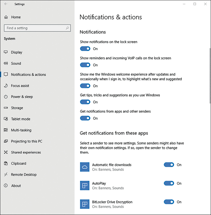 A screenshot shows the Notifications & Actions page within the Settings app. Along the left is a list of System items, and the main body of the screen is split into two sections. The top section shows Notifications including sliders for Show Notifications On The Lock Screen and Show Reminders And Incoming VoIP Calls On The Lock Screen. In the lower half, the Get Notifications From These Apps section shows two apps with configuration sliders to the their right.