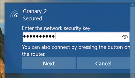 A screenshot shows the security banner for connecting to a wireless network. The password is entered in the Enter The Network Security Key box. Buttons for Next and Cancel are available.