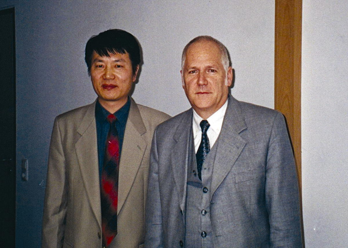 Photo of Professor Xiaoting Rui (left) standing beside Professor Peter Maisser (right).