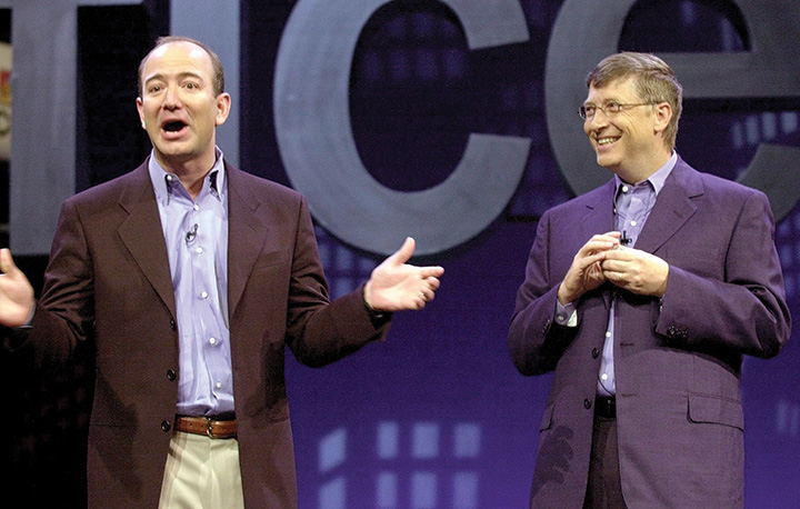 A photo shows Jeff Bezos and Bill Gates on stage.