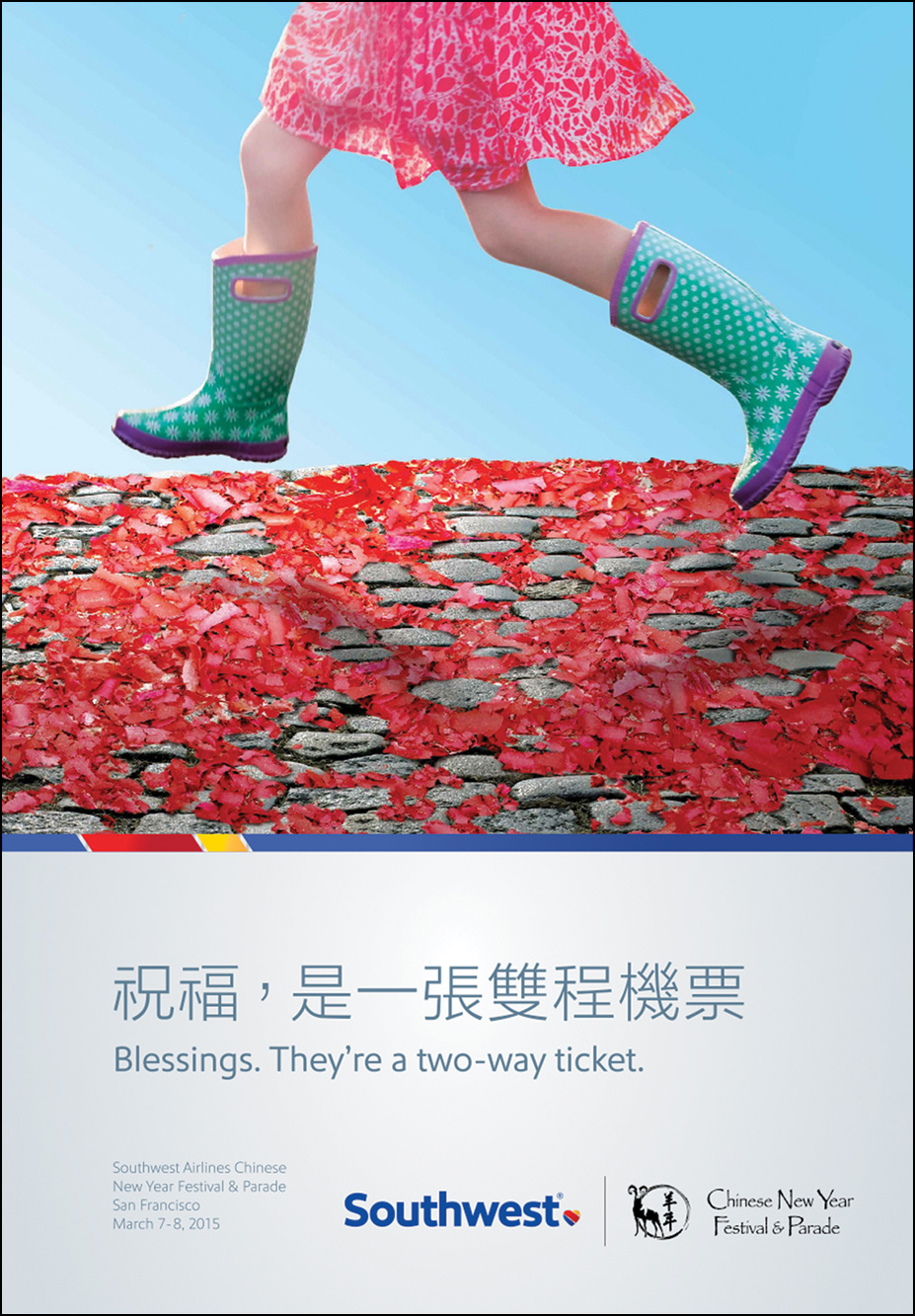 An advertisement of Southwest Airlines shows a young girl scampering across a flower-strewn patch. The advertisement carries Japanese text. Below it is the text “Blessings. They're a two-way ticket.”