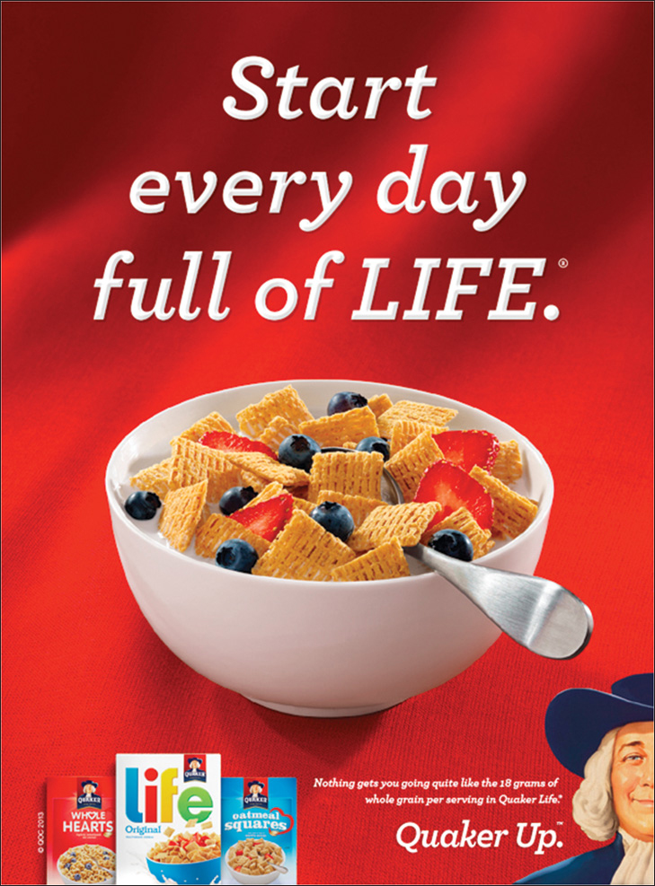 A Quaker advertisement shows a cup of Quaker oats with grapes and milk. Above the cup, the advertisement has the text “Start everyday full of LIFE.” The bottom of the advertisement has the words “Quaker Up.”