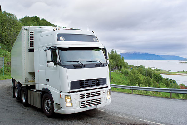 Photo shows a truck on a road.