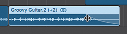 A screenshot of the workspace area shows the region of Groovy Guitar track at bar 9. The left edge of the fade is Control-Shift-dragged to adjust its length. The resize pointer appears while the fade is adjusted.